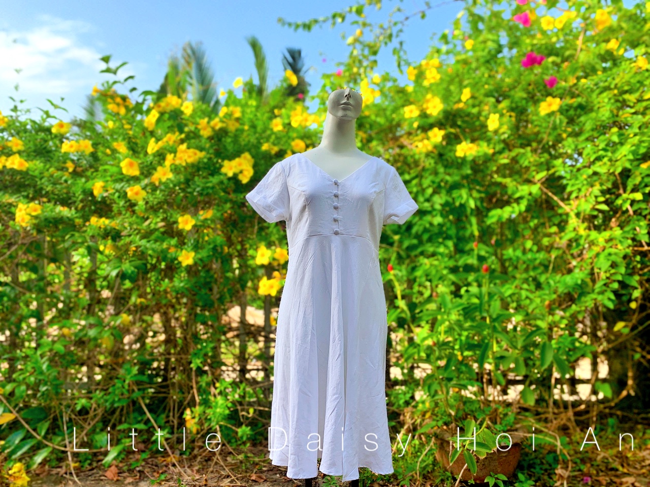 white linen dress Hoi An with hand embroidery